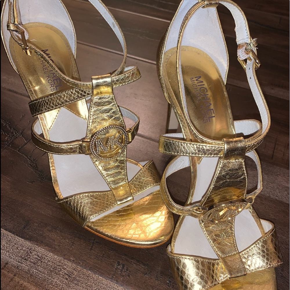 A cute pair of elegant gold Michael Kors heels